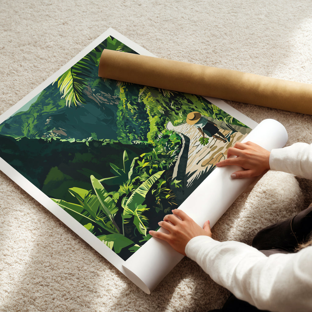 Person unrolling a Madeira travel poster art depicting a lush green mountain landscape and tropical path.